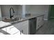 Modern kitchen with stainless steel dishwasher and granite countertops at 5623 80Th St N # 510, St Petersburg, FL 33709
