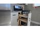 Modern kitchen with wooden drawer and stainless steel appliances at 5623 80Th St N # 510, St Petersburg, FL 33709