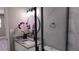 Modern bathroom with a frameless shower and granite countertop at 5623 80Th St N # 510, St Petersburg, FL 33709