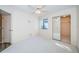 Well-lit bedroom with carpet flooring and mirrored closet doors at 4399 Brooker Creek Dr, Palm Harbor, FL 34685