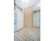 Bright entryway with tiled floors and a large mirror at 4399 Brooker Creek Dr, Palm Harbor, FL 34685