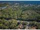 Wide aerial view of neighborhood and surrounding landscape at 4399 Brooker Creek Dr, Palm Harbor, FL 34685