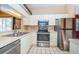 Galley kitchen with stainless steel appliances at 4399 Brooker Creek Dr, Palm Harbor, FL 34685