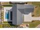 Aerial view showcasing a home with a pool and paved driveway at 901 38Th Ne Ave, St Petersburg, FL 33704