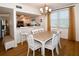 Open concept dining room with seating for six and kitchen views at 6575 99Th N Way # 22201, St Petersburg, FL 33708