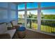 Spacious sunroom offering water views and comfortable wicker furniture at 6575 99Th N Way # 22201, St Petersburg, FL 33708