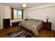 Spacious main bedroom with a king-size bed and wood furniture at 6575 99Th N Way # 22201, St Petersburg, FL 33708