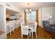 Elegant dining room with a large table and kitchen access at 6575 99Th N Way # 22201, St Petersburg, FL 33708