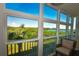 Bright sunroom showcasing serene water views and comfortable seating at 6575 99Th N Way # 22201, St Petersburg, FL 33708