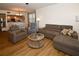 Bright living room featuring comfortable seating and a large glass-top coffee table at 6575 99Th N Way # 22201, St Petersburg, FL 33708