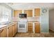 Bright kitchen featuring wood cabinets and ample counter space at 5319 Montego Dr, Zephyrhills, FL 33541