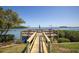 Wooden walkway leading to a waterfront patio at 1515 Pinellas Bayway S # B28, Tierra Verde, FL 33715