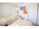 Bedroom with two twin beds and floral bedding, plus closet at 1515 Pinellas Bayway S # B28, Tierra Verde, FL 33715
