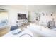 Open living space with dining area, balcony access and TV at 1515 Pinellas Bayway S # B28, Tierra Verde, FL 33715