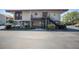 Condo building entrance with stairs and mailbox area at 1515 Pinellas Bayway S # B28, Tierra Verde, FL 33715