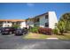 Two-story condo building with parking and landscaping at 1515 Pinellas Bayway S # B28, Tierra Verde, FL 33715