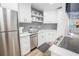 Updated kitchen with stainless steel appliances and white shaker cabinets at 1515 Pinellas Bayway S # B28, Tierra Verde, FL 33715