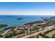 Aerial view of waterfront community with pool and tennis courts at 1515 Pinellas Bayway S # B28, Tierra Verde, FL 33715