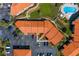 Aerial view showcasing building and parking at 1515 Pinellas Bayway S # B28, Tierra Verde, FL 33715