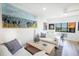 Living area with comfy sofas, wood floors, and coastal decor at 1515 Pinellas Bayway S # B28, Tierra Verde, FL 33715