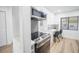 Modern kitchen with stainless steel appliances and a built-in microwave at 1515 Pinellas Bayway S # B28, Tierra Verde, FL 33715