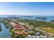 Aerial view of waterfront property with tennis courts at 1515 Pinellas Bayway S # B28, Tierra Verde, FL 33715