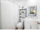 Clean bathroom with white vanity, toilet, and shower at 1515 Pinellas Bayway S # B28, Tierra Verde, FL 33715