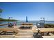 Relaxing waterfront patio with picnic tables at 1515 Pinellas Bayway S # B28, Tierra Verde, FL 33715
