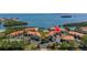 Aerial view of waterfront condos with pool and tennis courts at 1515 Pinellas Bayway S # B28, Tierra Verde, FL 33715