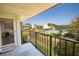 Balcony view overlooking pool, grounds, and waterway at 1515 Pinellas Bayway S # B28, Tierra Verde, FL 33715