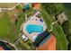 Community pool and spa with surrounding patio at 1515 Pinellas Bayway S # B28, Tierra Verde, FL 33715