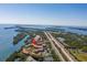 Aerial view of waterfront community with pool and tennis courts at 1515 Pinellas Bayway S # B28, Tierra Verde, FL 33715