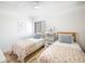 Bedroom with two twin beds and floral bedding at 1515 Pinellas Bayway S # B28, Tierra Verde, FL 33715