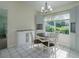 Bright dining area with window and chandelier at 8111 Riverside Ne Dr, St Petersburg, FL 33702