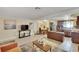Spacious living area seamlessly connects to the dining area and kitchen, creating an open and airy atmosphere at 10801 Fillmore Ave, Port Richey, FL 34668