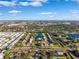 Aerial view of an apartment complex near a lake with surrounding houses at 1660 83Rd N Ave, St Petersburg, FL 33702