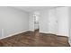 Bedroom with wood floors and access to bathroom at 3121 Briar St, Wesley Chapel, FL 33543
