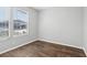 Simple bedroom with wood floor and neutral walls at 3121 Briar St, Wesley Chapel, FL 33543