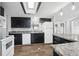 Modern kitchen, granite counters, and breakfast bar at 3121 Briar St, Wesley Chapel, FL 33543