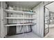Workshop with pegboard walls, shelving, and a window at 3121 Briar St, Wesley Chapel, FL 33543