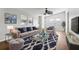 Living room with hardwood floors, ceiling fan, and stylish furniture at 3121 Briar St, Wesley Chapel, FL 33543