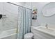 Clean bathroom with marble tile and a shower/tub combo at 5221 Chaney Ter, Port Charlotte, FL 33981