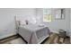 Light and airy bedroom with a comfortable bed and soft decor at 5221 Chaney Ter, Port Charlotte, FL 33981