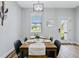 Dining room with wood table, four chairs, and access to the backyard at 5221 Chaney Ter, Port Charlotte, FL 33981