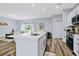 Modern kitchen with island and stainless steel appliances at 5221 Chaney Ter, Port Charlotte, FL 33981