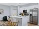 Modern kitchen with stainless steel appliances and white cabinets at 5221 Chaney Ter, Port Charlotte, FL 33981