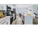 Modern kitchen with stainless steel appliances and white cabinetry at 5221 Chaney Ter, Port Charlotte, FL 33981