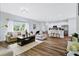 Open floor plan living room and kitchen with wood floors at 5221 Chaney Ter, Port Charlotte, FL 33981