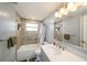 Updated bathroom with tiled shower, new vanity, and modern fixtures at 5346 Quist Dr, Port Richey, FL 34668