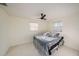 Bright bedroom with ceiling fan, natural light, and spacious layout at 5346 Quist Dr, Port Richey, FL 34668